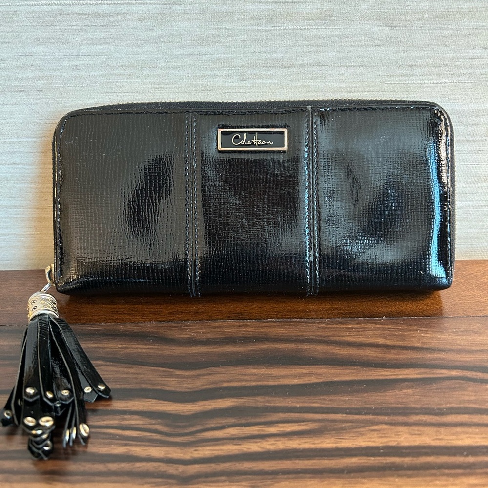 Cole Haan Black Patent Leather Tassel Zip Wallet
